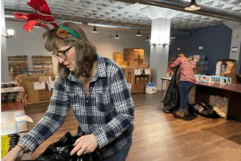 Thames Valley Council for Community Action employees prepare toys to be given at the Norwich Tommy Toy Fund distribution site.